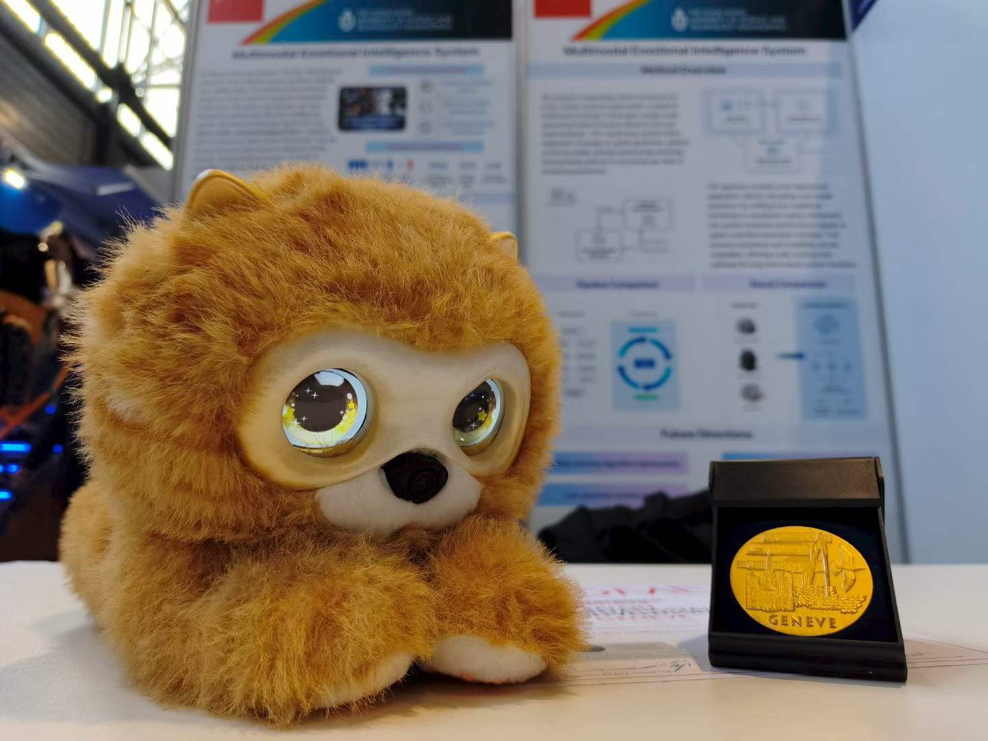 Lumi Cat prototype displayed beside a Geneva award medal.